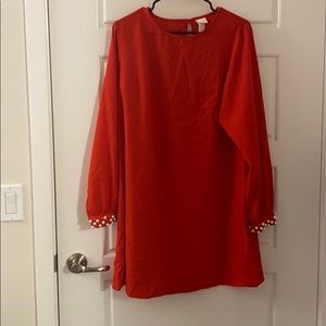 Mini red dress with pearl sleeve detail